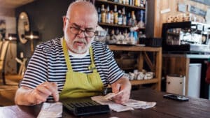 Man Looking at Receipts