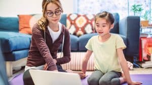 mother and daughter looking at computer screen